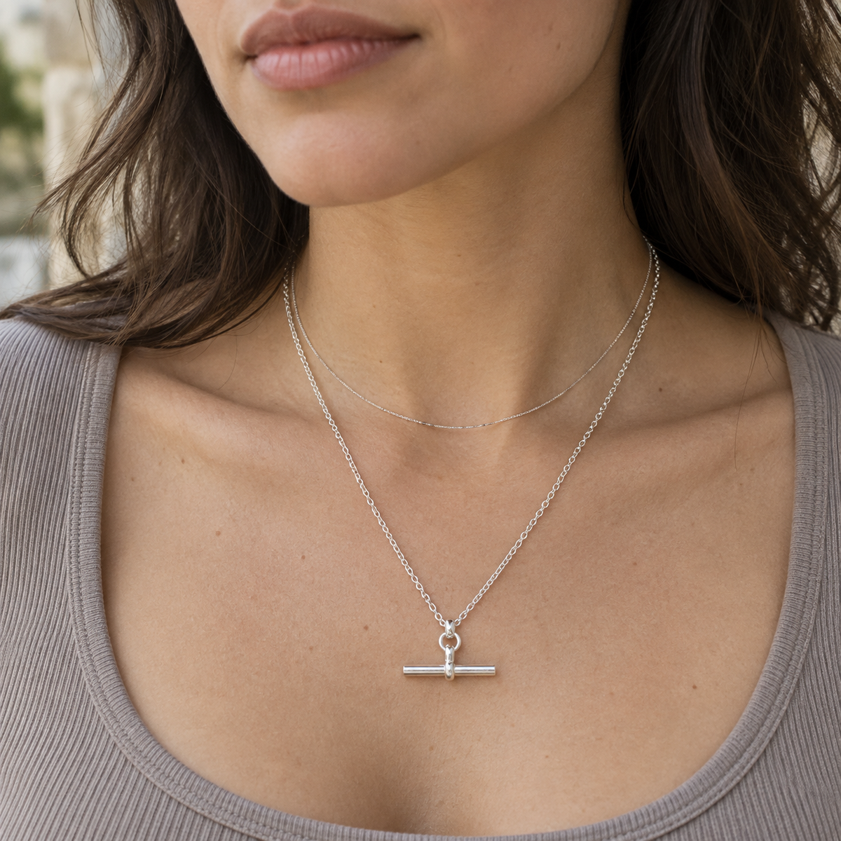 Model wearing the Silver T-Bar Chain layered with a finer chain