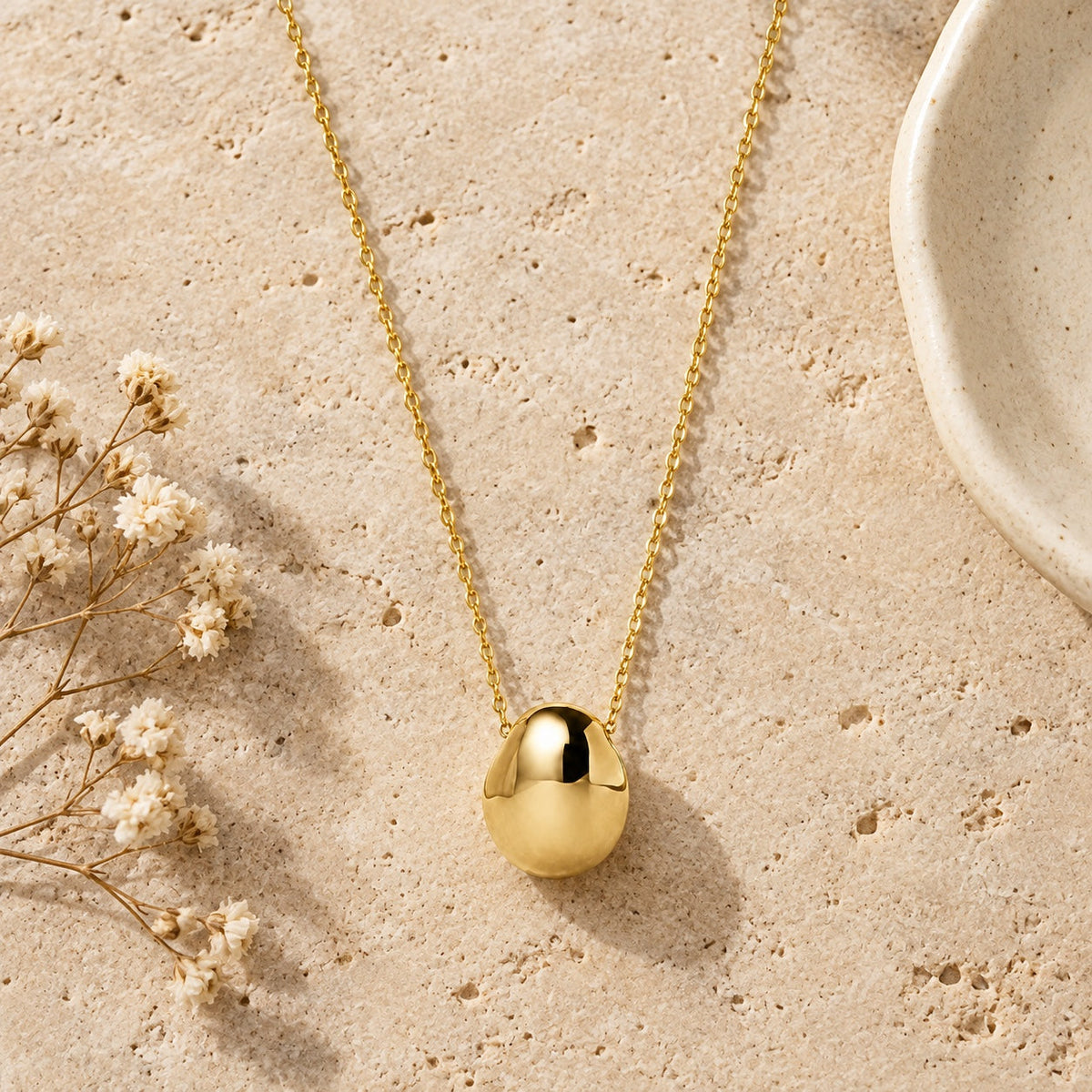 Gold Pebble Pendant Necklace styled